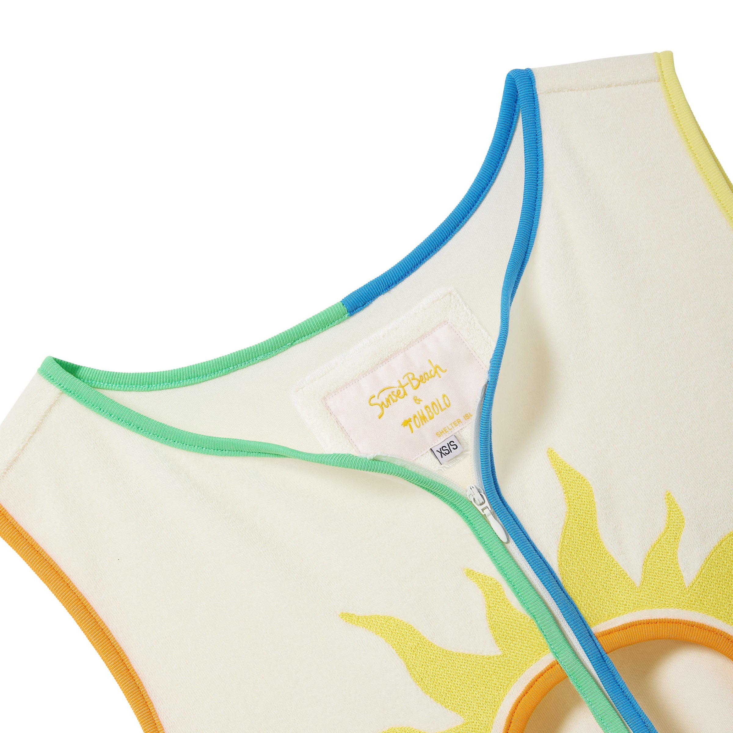 Hand towel top with sun design and colorful trim on a white background